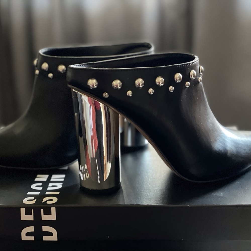 -Studded leather Mules make a statement with chrome studded heels